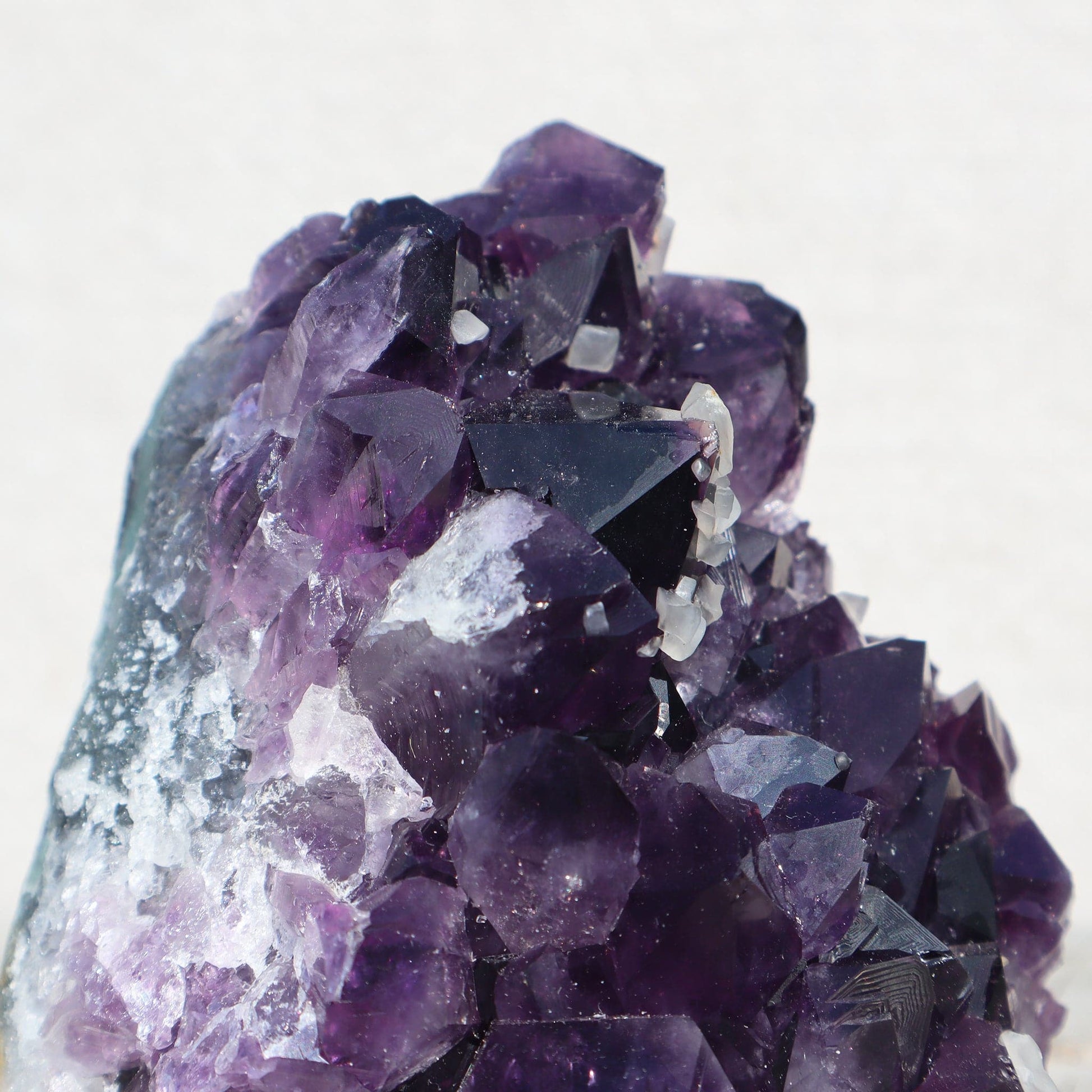Raw_amethyst_quartz_crystals_calcite_cluster - Deepest_Earth