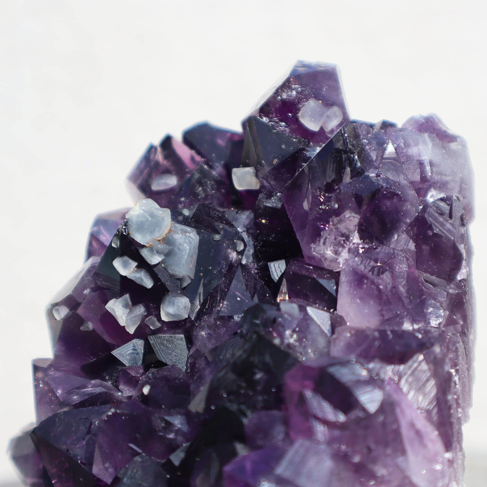 Raw_amethyst_quartz_crystals_calcite_cluster - Deepest_Earth