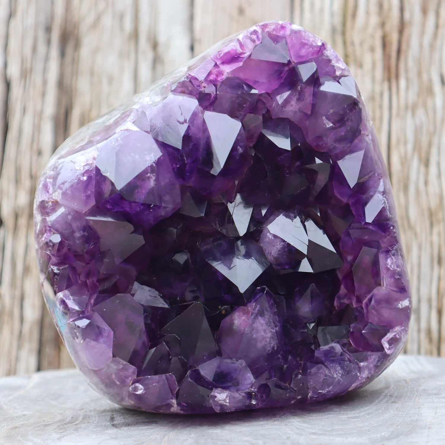 Deep, purple amethyst, geode with visible cut stalactite