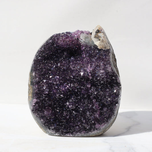 Zen-inspiring sparkly deep purple amethyst. Rare crystalized celadonite by the most unique calcite formation.