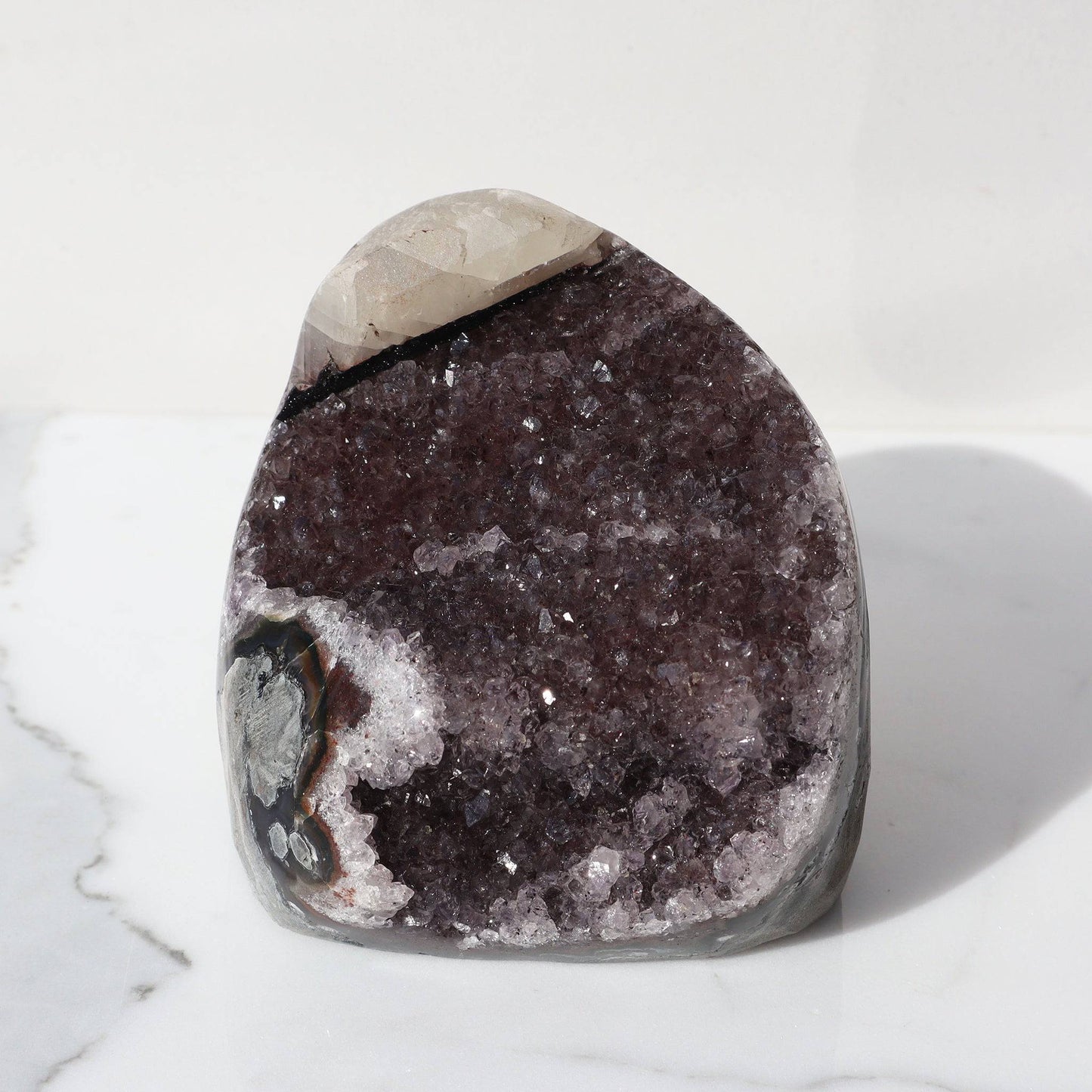 Unusual brown shade of amethyst with a nearly white calcite formation, white quartz band and brown agate contoured by green celadonite.
